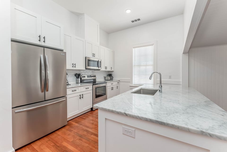 High end kitchen with marble countertops, stainless appliances, and all the equipment and dishware to serve some excellent Georgia Shrimp.