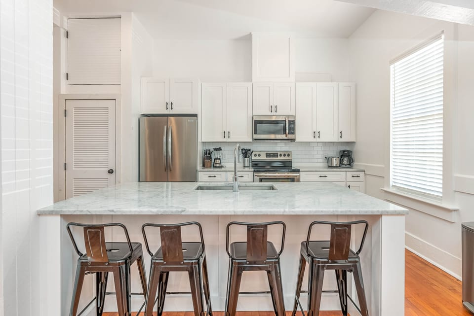 High end kitchen with marble countertops, stainless appliances, and all the equipment and dishware to serve some excellent Georgia Shrimp.