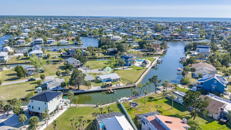 Aerial view of Sunshine Escape perfectly positioned on a spacious waterfront lot in beautiful Hernando Beach.