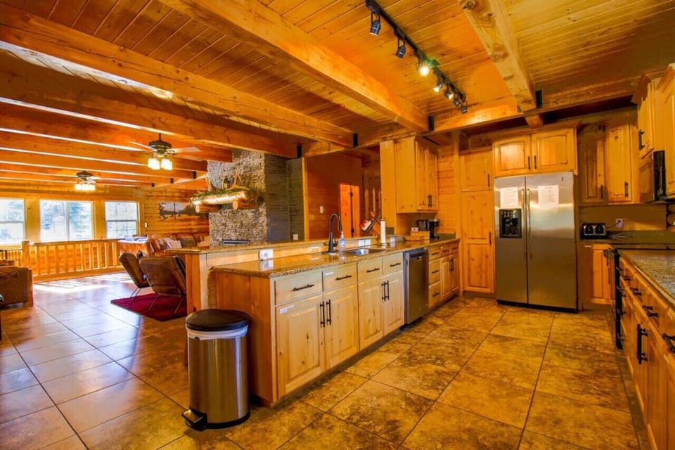 Experience the seamless flow of this open-concept space, where the living room, dining area, and kitchen come together effortlessly.