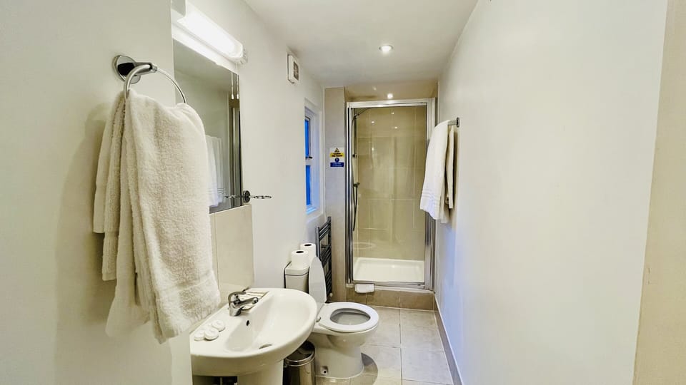 Quad Room | Bathroom | Hair dryer, towels