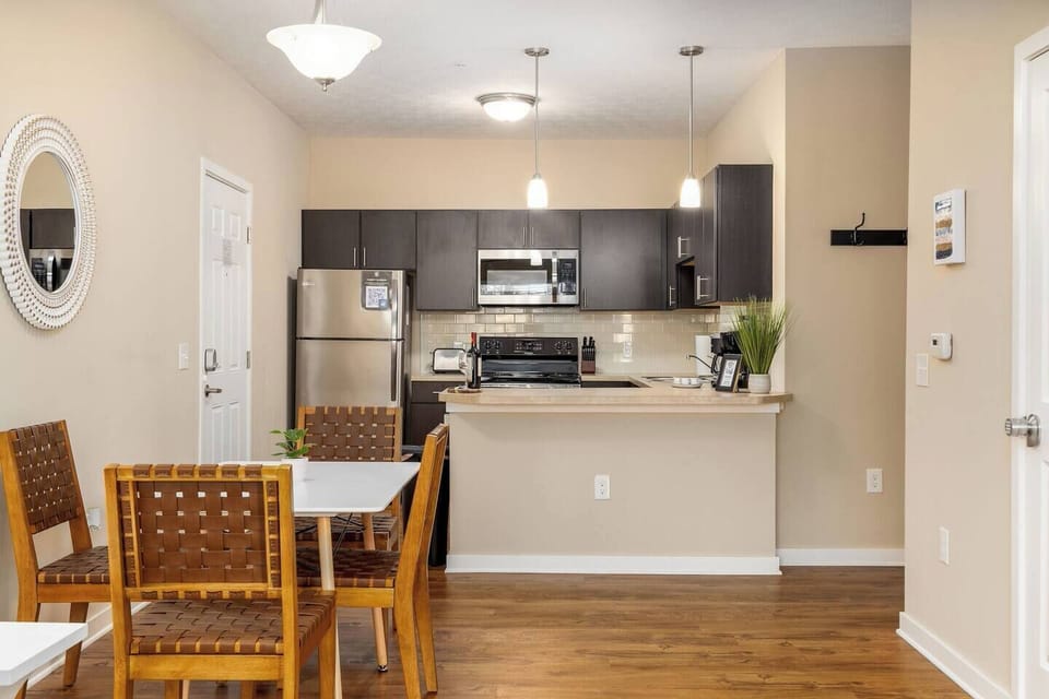 A view of the kitchen and dining area from the living room. 
