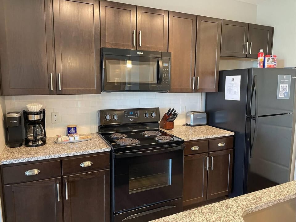 Lots of cabinets - fully stocked with enough kitchenware to cook a gourmet meal. This apartment is designed with long stays in mind. :) 