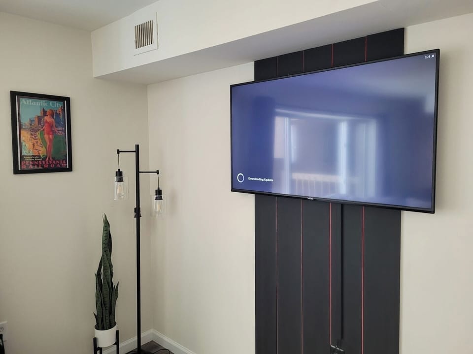 Hip and Modern Living Room Area featuring Large Smart TV