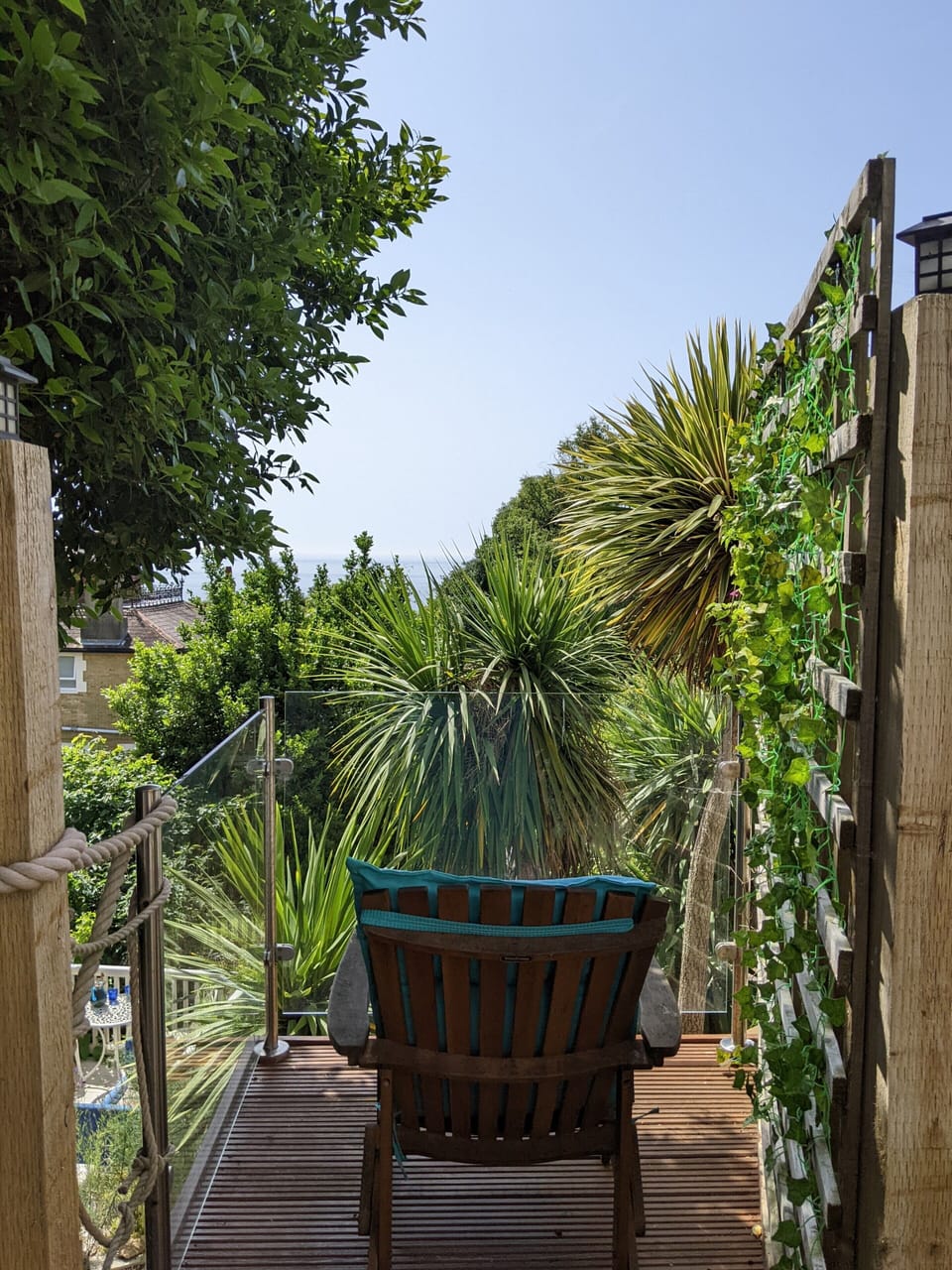 Enjoy the sea view next to palm trees on your private decking area