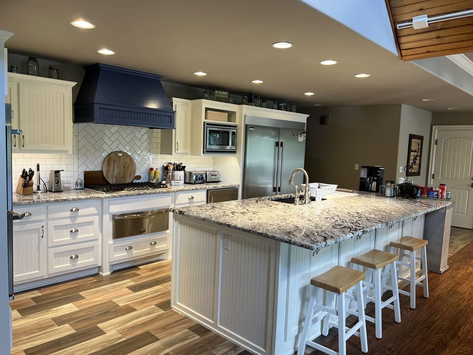 Kitchen Island, double fridge and freezer, microwave,and beverage refrigerator 