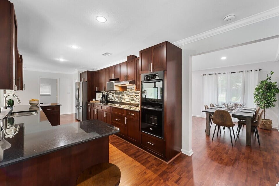 Spread out in the spacious layout of this Fort Lauderdale home, which offers 3 bedrooms & 2 full bathrooms, separate living area with a comfy sofa, a modern dining table, game room with ping pong & foosball tables, large kitchen with updated appliances and bar seating, TV's in all rooms, separate laundry room and contemporary touches throughout!