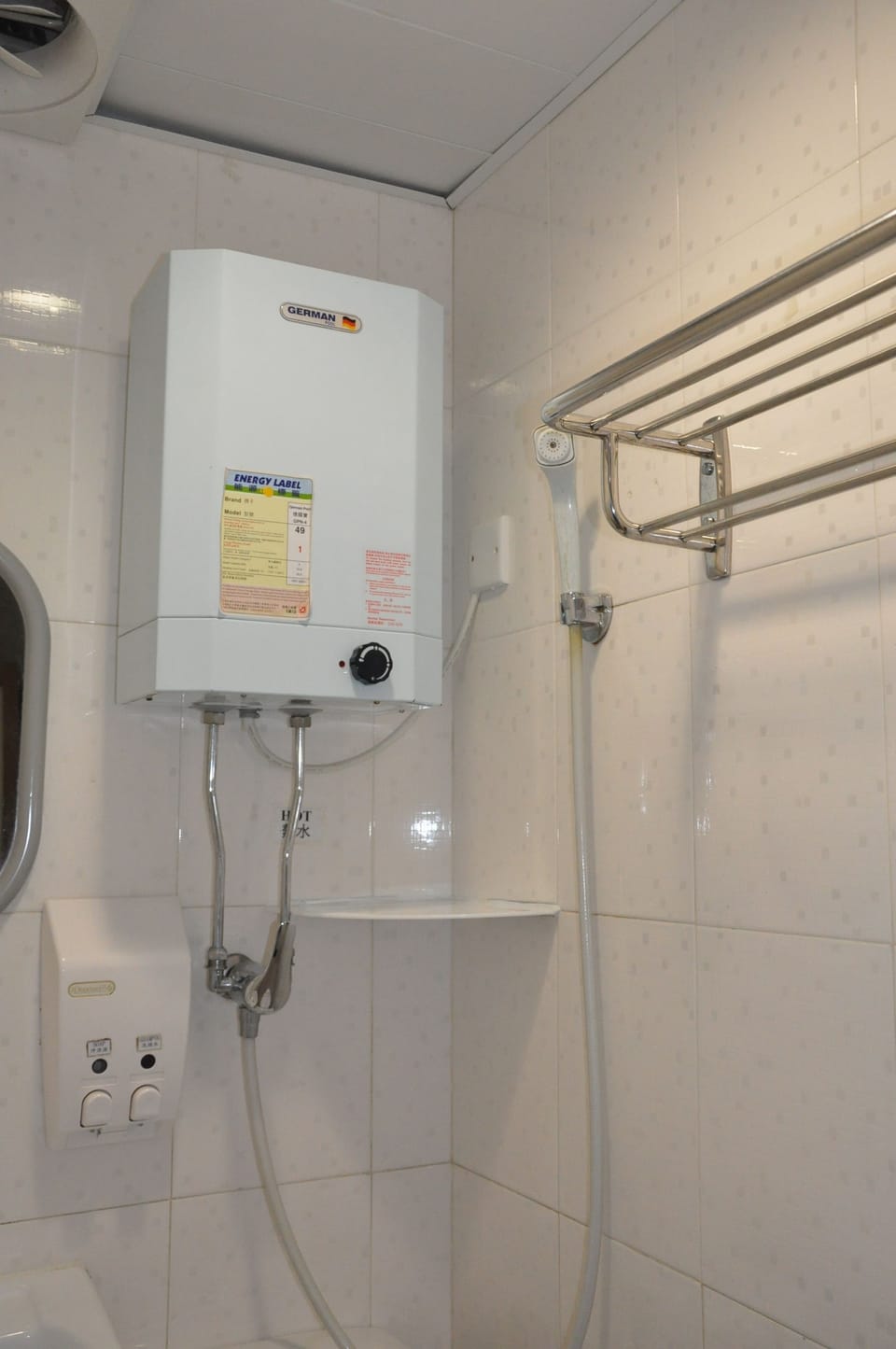Shower, hair dryer, slippers, towels