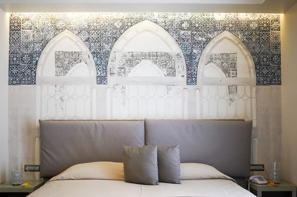 Deluxe Double Room, Balcony, Partial Sea View | Minibar, in-room safe, desk, soundproofing
