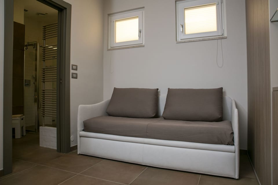 Deluxe Double Room, Balcony, Partial Sea View | Minibar, in-room safe, desk, soundproofing