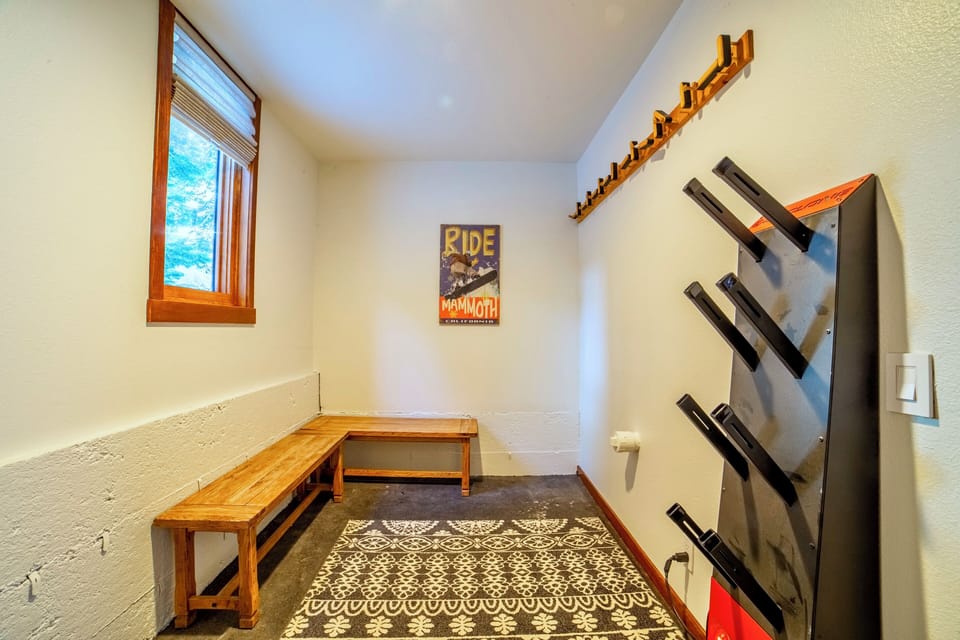 Equipment storage room in garage with boot dryer!