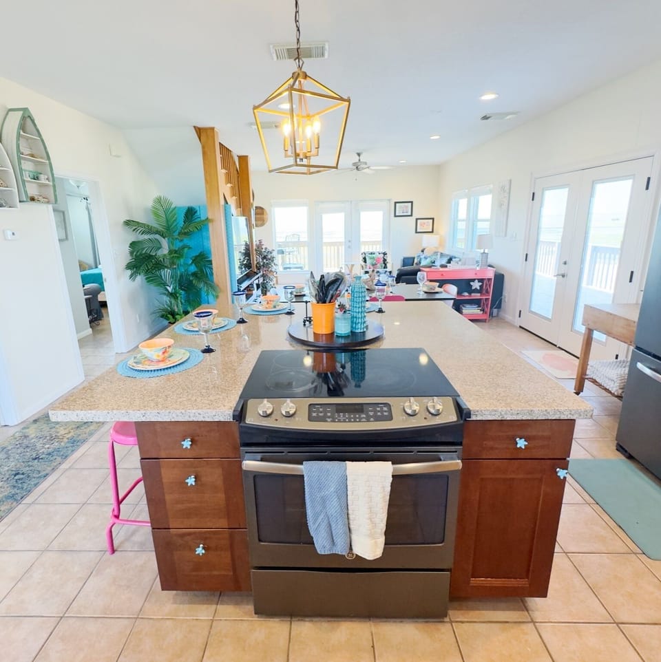 Island bar with built in stove-perfect for entertaining while prepping meals!