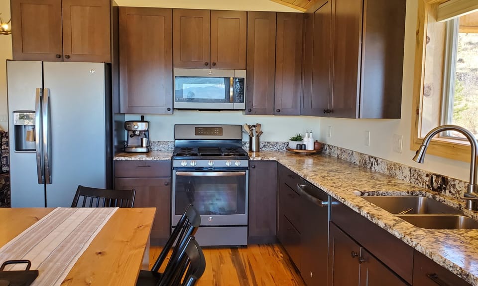 High end gas appliances and an outdoor grill support cooking just like at home. 
