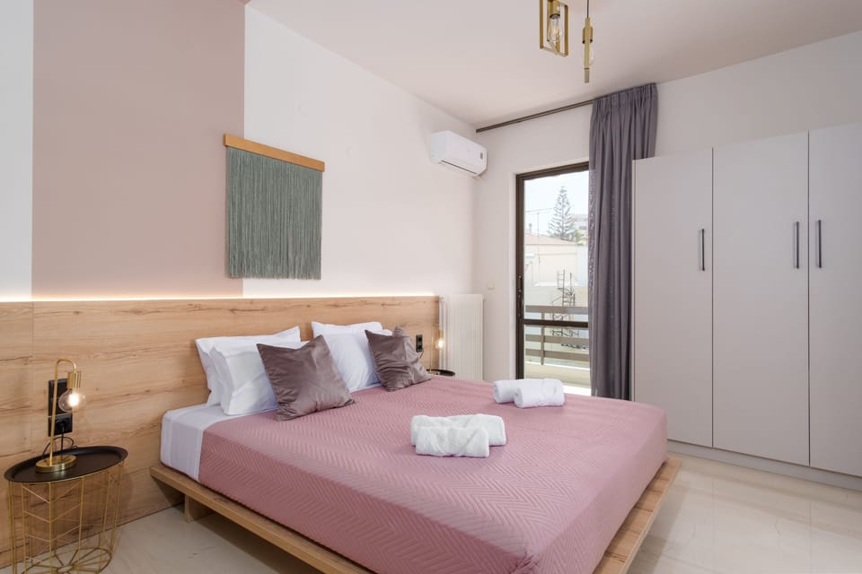 Bedroom with a queen size bed and balcony