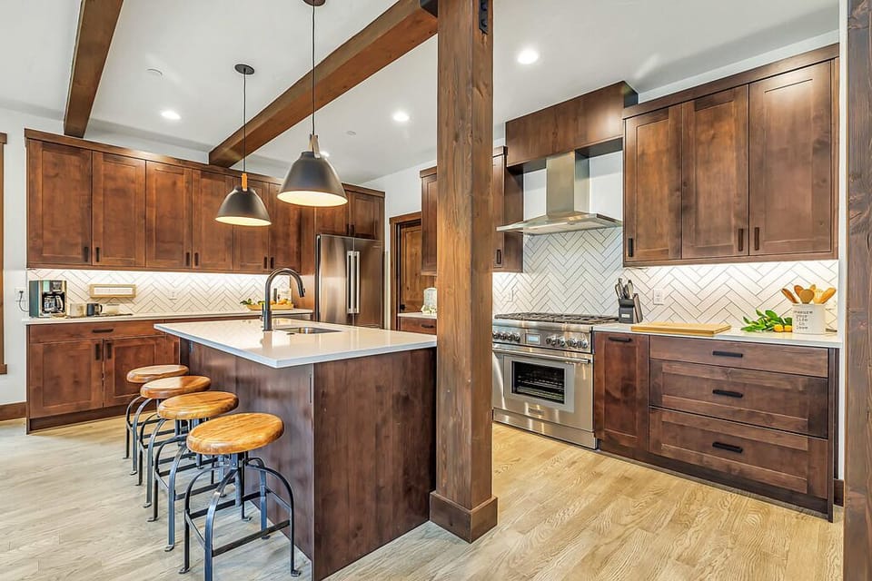 Kitchen – Center Island Seating + Wood Beams + Pendant Lighting