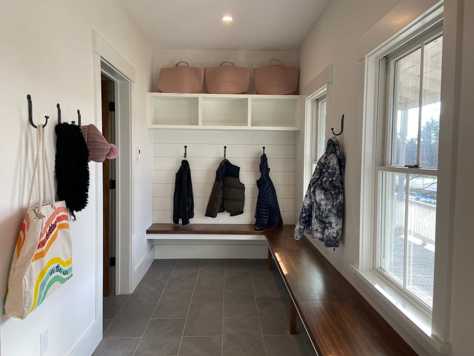 Just to the right of the front door is the mudroom with a massive walnut bench for the whole family to take off their boots. Fear not, the floor is heated to keep your tootsies warm during cold winter days.