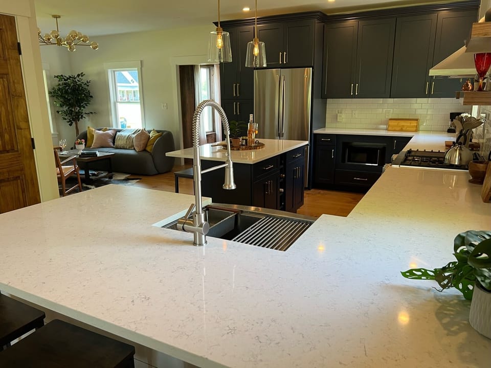 Sit one one of the three peninsula barstools and gaze across this chef's kitchen.