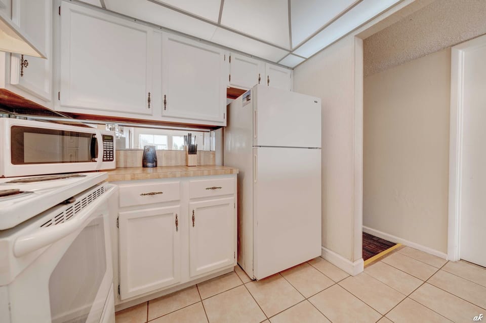The well-equipped kitchen boasts modern appliances and all the cooking essentials you need to whip up delicious meals with ease.
