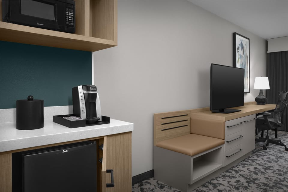 Desk, blackout drapes, iron/ironing board, free cribs/infant beds