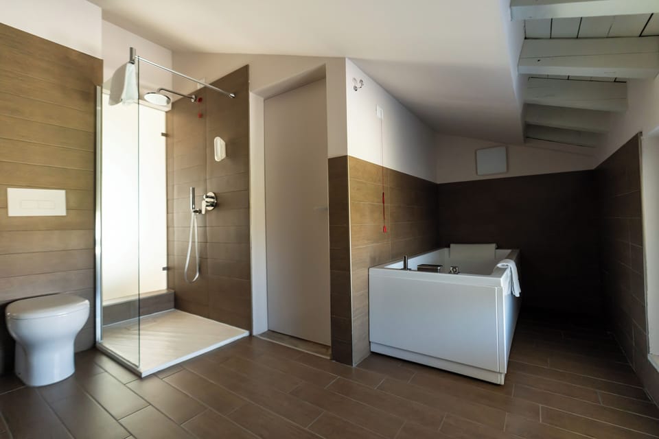 Romantic Suite, Hot Tub | Bathroom | Free toiletries, hair dryer, bathrobes, bidet