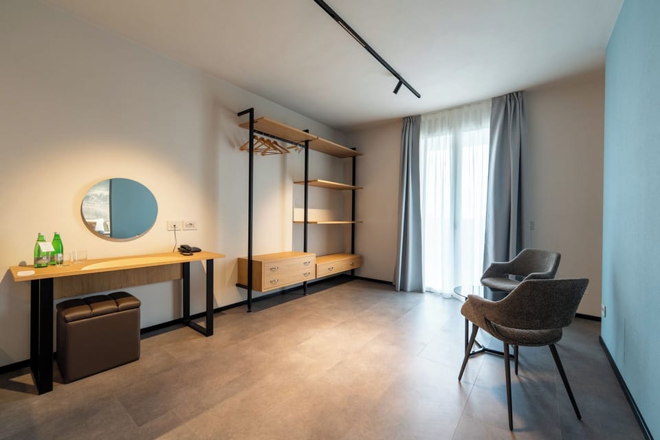 Superior Suite | Living area | 21-inch TV with satellite channels