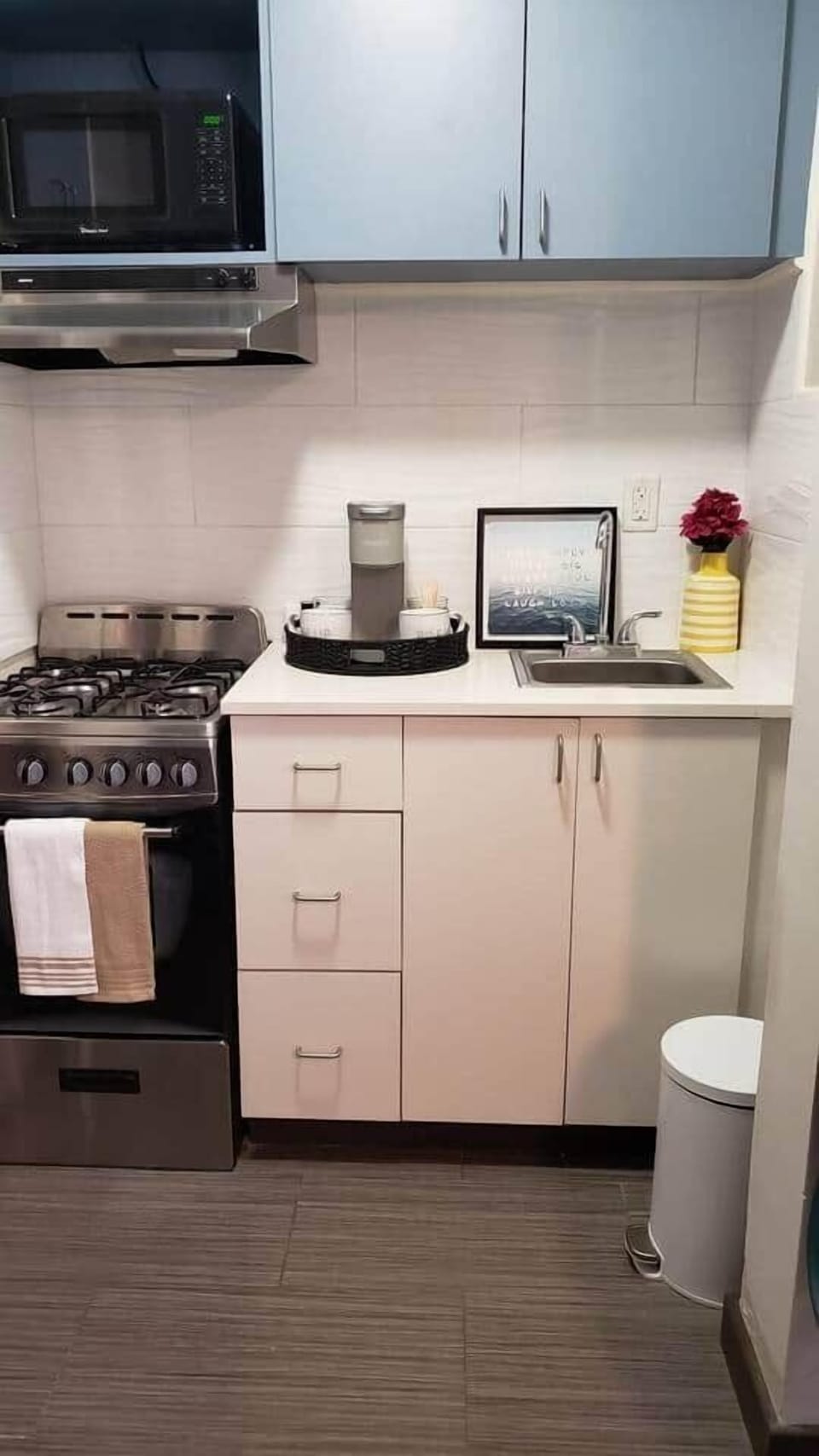 Full Kitchen with gas stove and oven, microwave, full refrigerator and sink.  Fully stocked with all your needs.