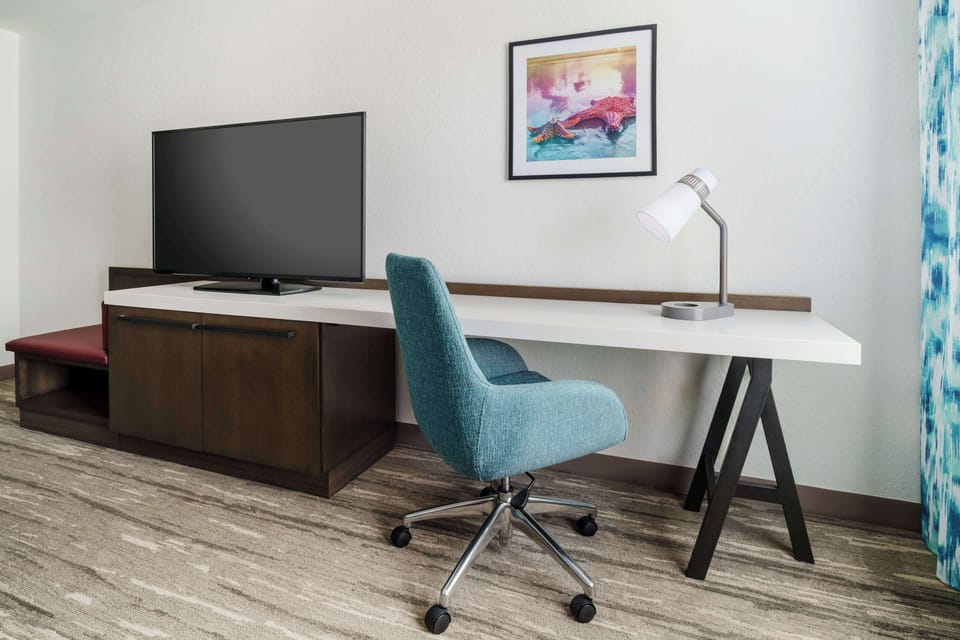 Desk, blackout drapes, iron/ironing board, free cribs/infant beds