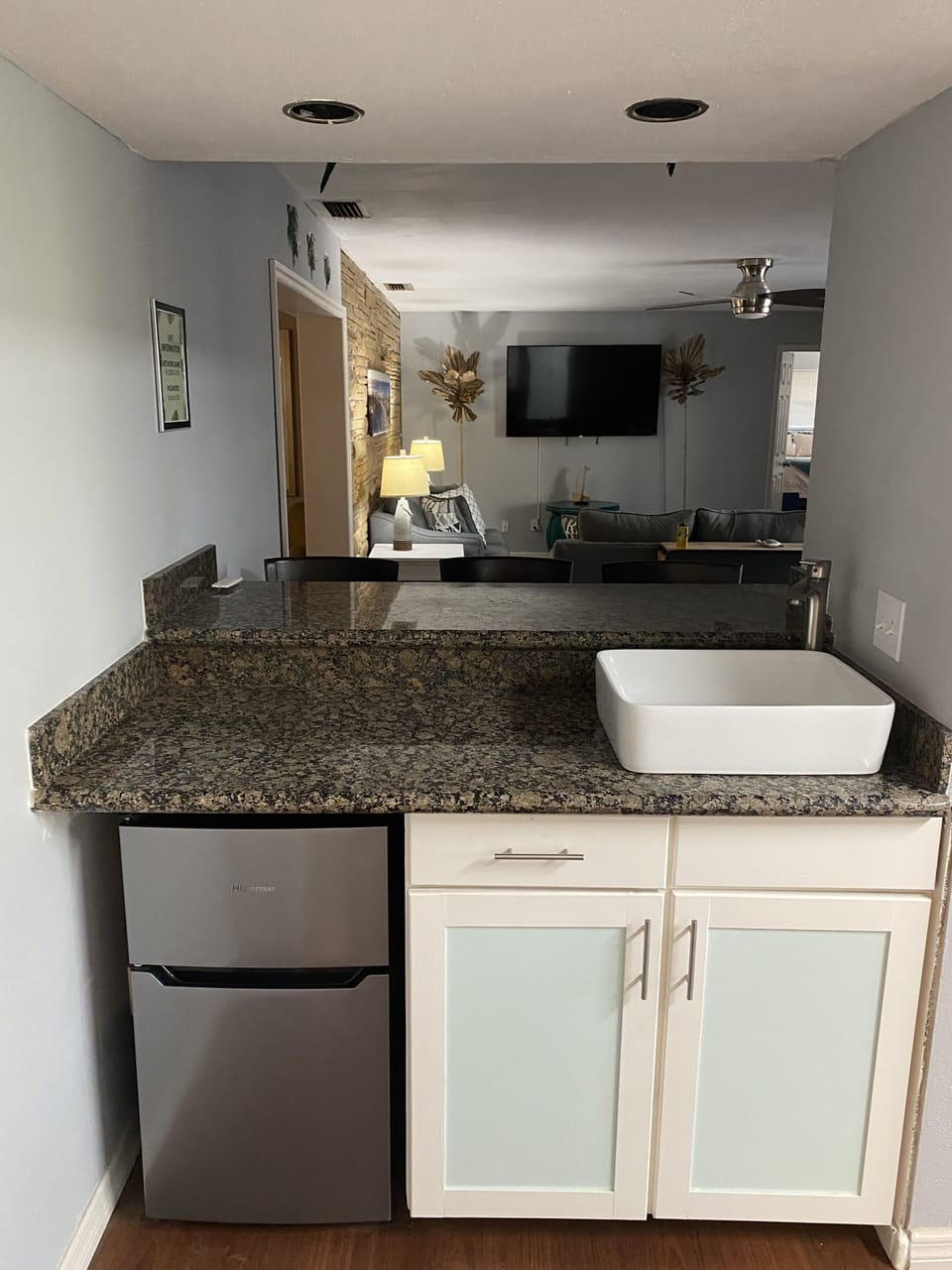 Indoor bar area with wet bar sink for the bartenders.