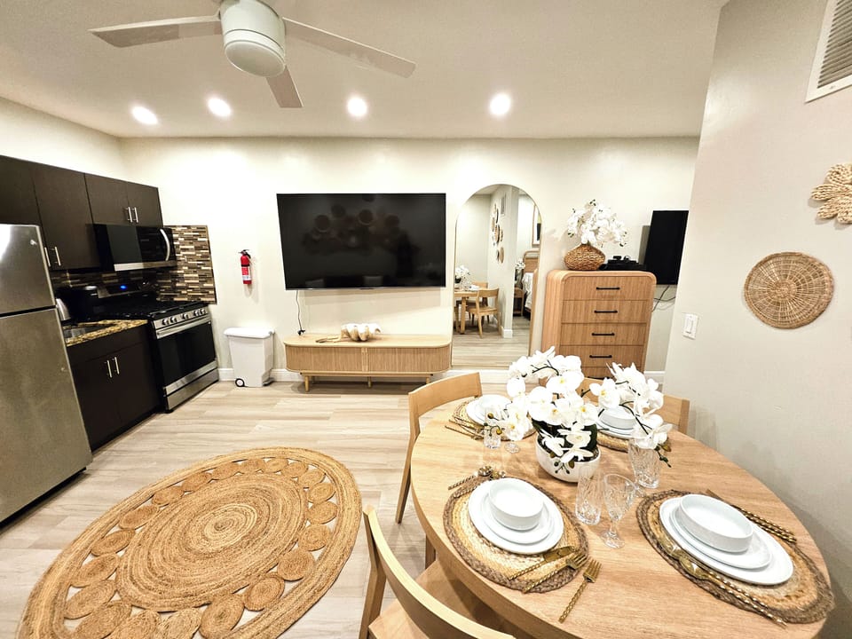 Standard Apartment, 1 Queen Bed, Non Smoking, Pets Not Allowed (Suite Five) | Living area | 65-inch flat-screen TV with satellite channels, TV