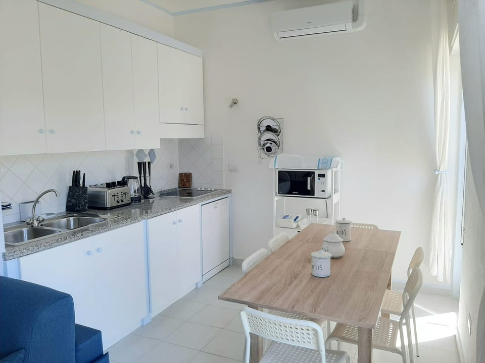 Apartment | Private kitchen | Fridge, microwave, stovetop, dishwasher