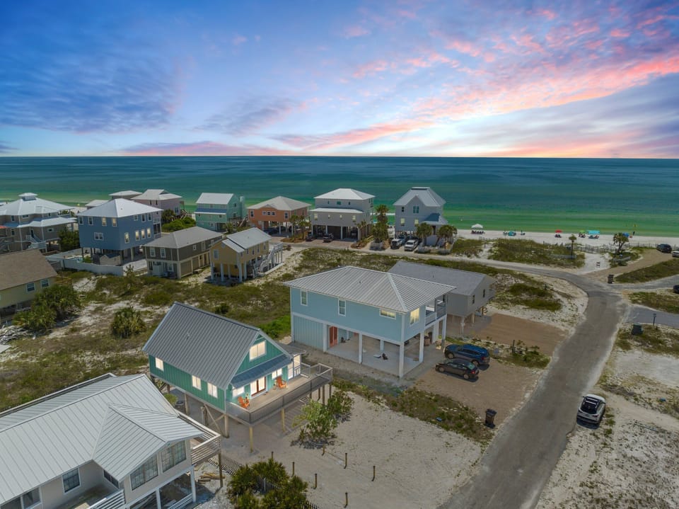 Steps from the shore, this 3-bedroom, 2-bath home offers beachside bliss. 