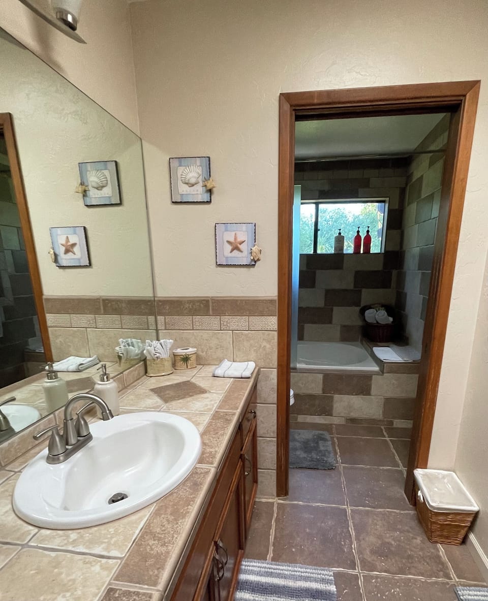 Separate water closet.  Large  jetted  whirlpool tub. 
