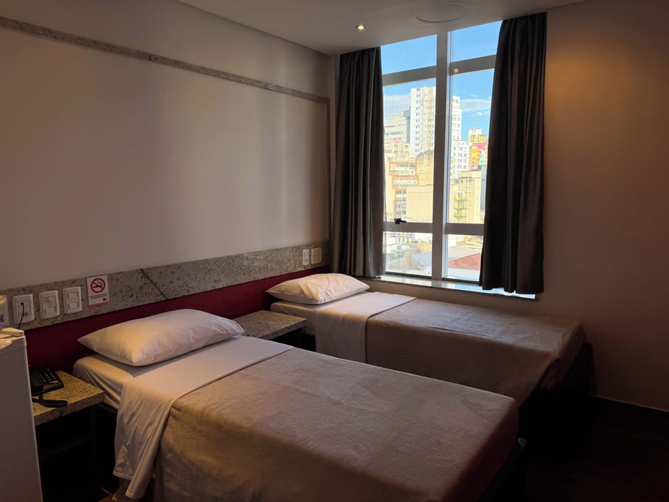 Twin Room | Minibar, desk, blackout drapes, free WiFi