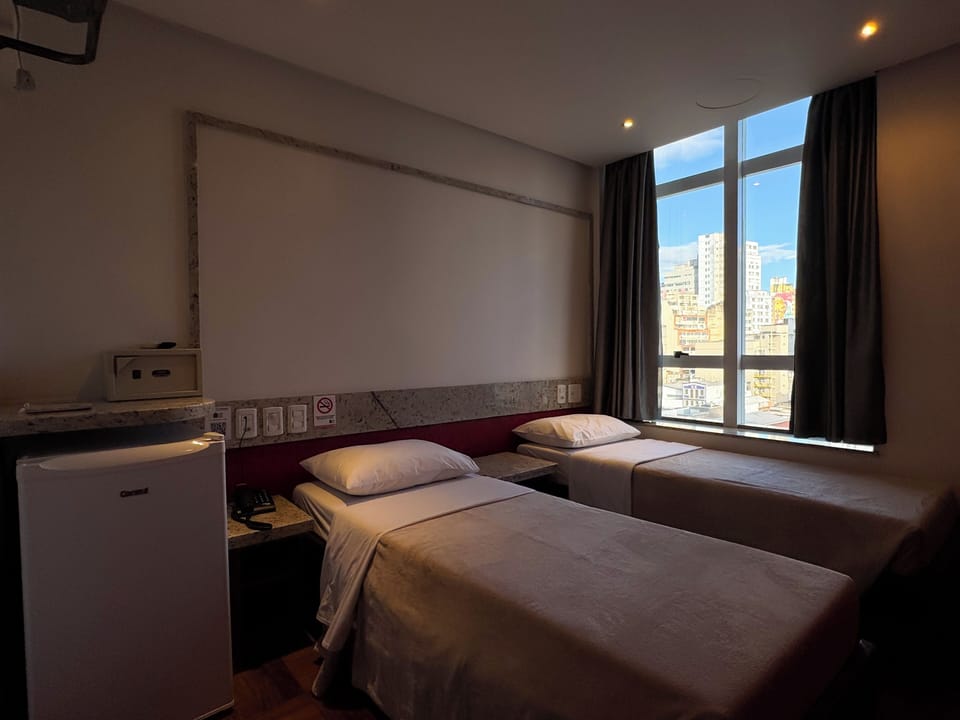 Twin Room | Minibar, desk, blackout drapes, free WiFi