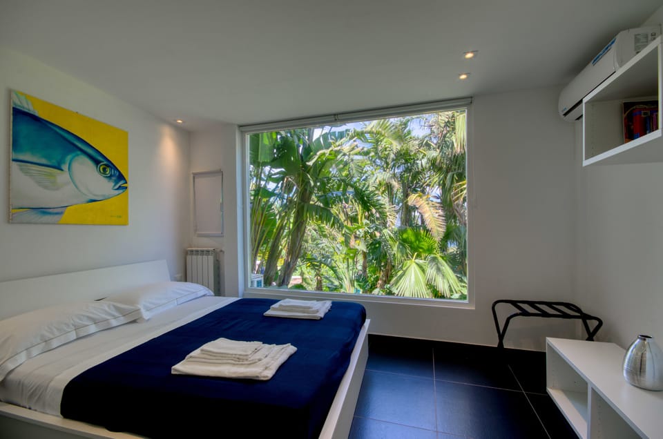 Panoramic Apartment, 1 Bedroom, Sea View, Garden Area with Hydromassage (Private entrance) | In-room safe, blackout drapes, iron/ironing board, travel crib