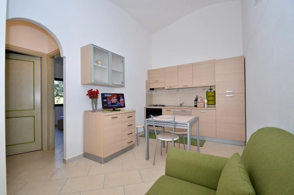 Family Apartment, 2 Bedrooms, Private Pool (Località Piricone) | Private kitchenette | Full-size fridge, cookware/dishes/utensils