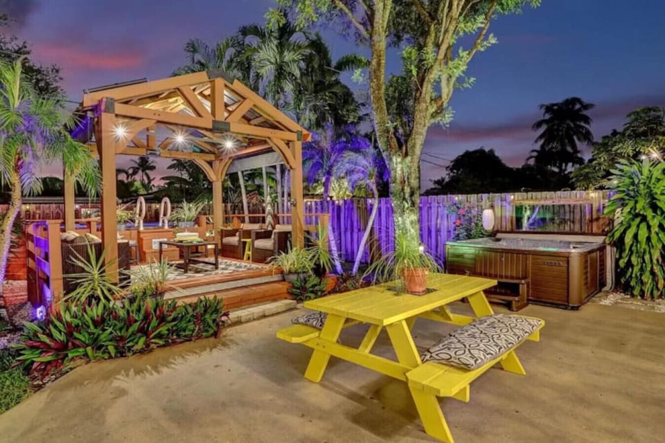 Beautiful private backyard space with pool, hot tub, BBQ, and shaded pergola seating area