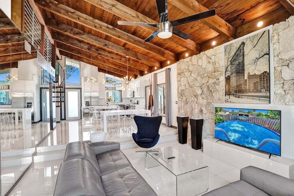 Fully renovated open concept home with tall vaulted ceilings and high-end decor