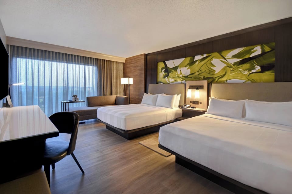 Premium bedding, desk, laptop workspace, iron/ironing board