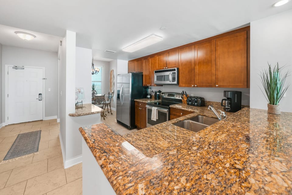Your fully equipped kitchen features granite countertops, stainless steel appliances, and everything you need to prepare delicious meals during your stay.