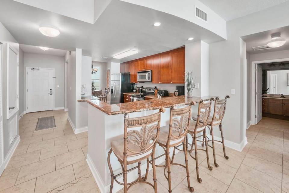 Your open kitchen features a breakfast bar where you can enjoy morning coffee while planning your day in paradise.