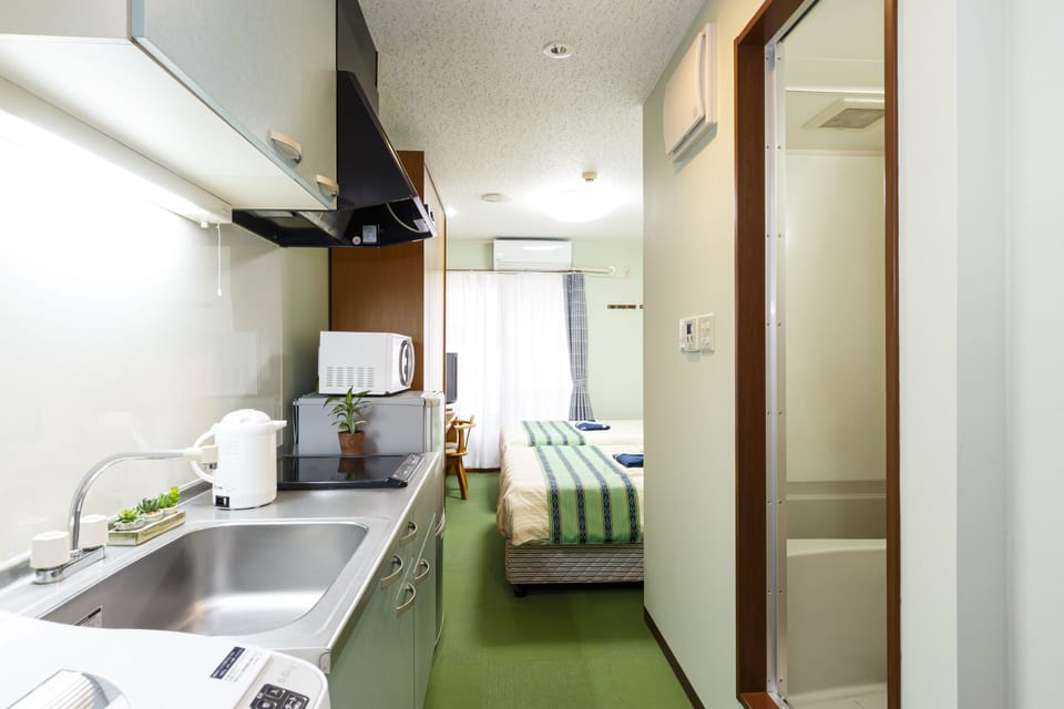 Twin Room, 2 Bedrooms | Desk, WiFi (free), bed sheets