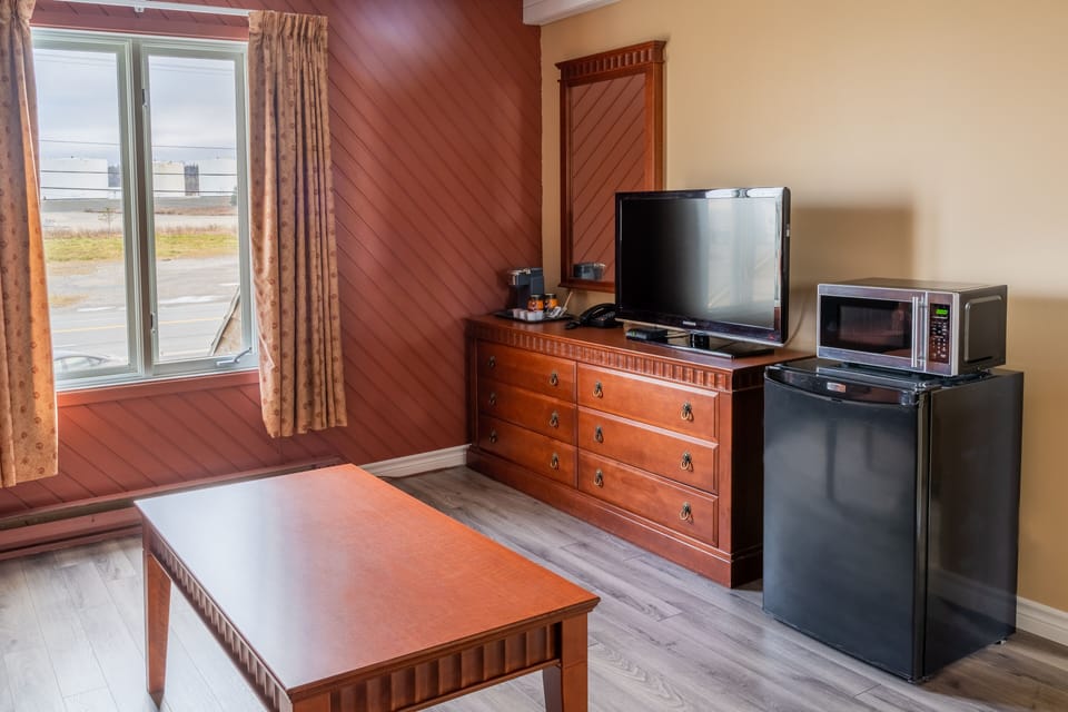 Executive Suite, 2 Bedrooms | Living area | TV
