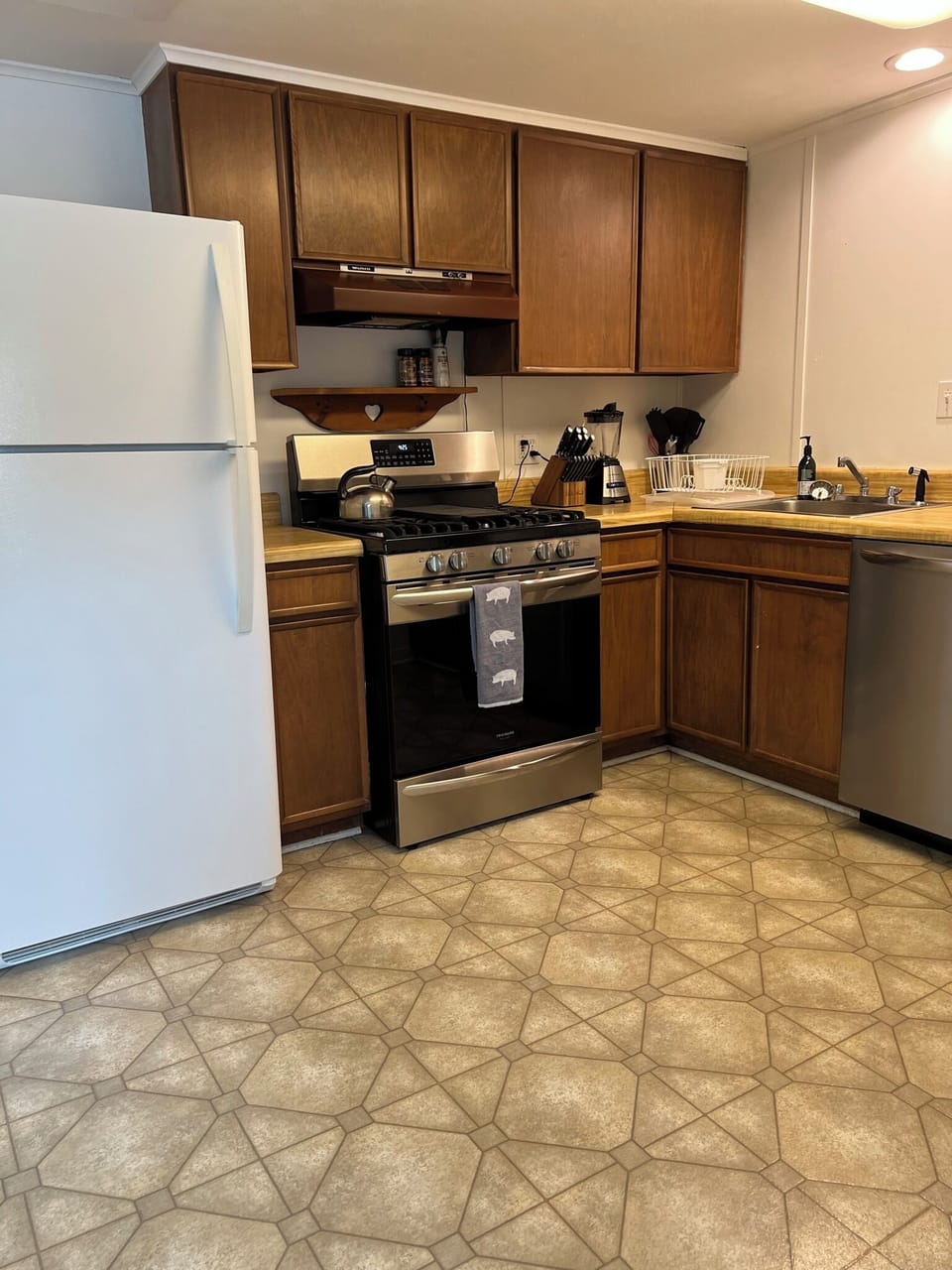 Full kitchen - refrigerator, high end gas stove with built in air fryer