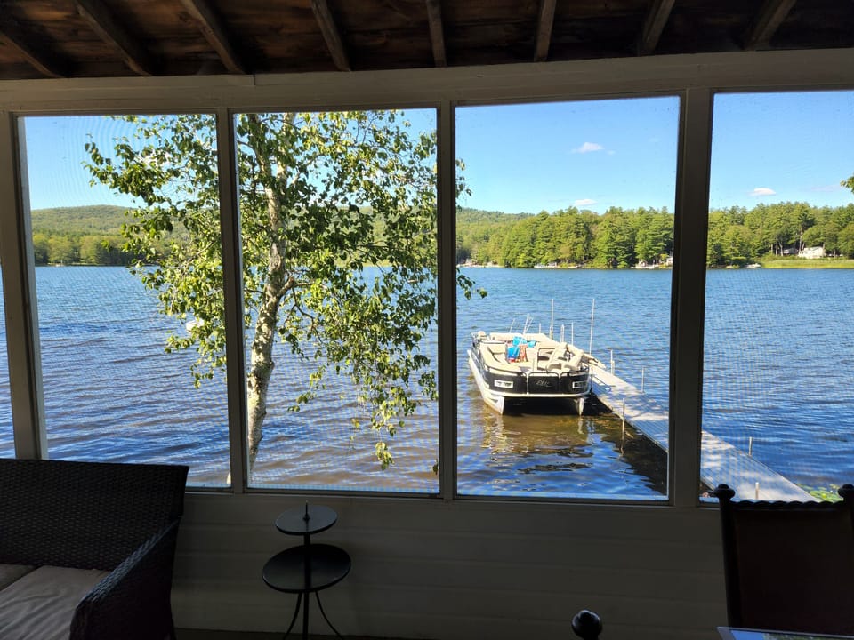 A view of the dock and the lake. Pontoon boat shown for effect, not included.