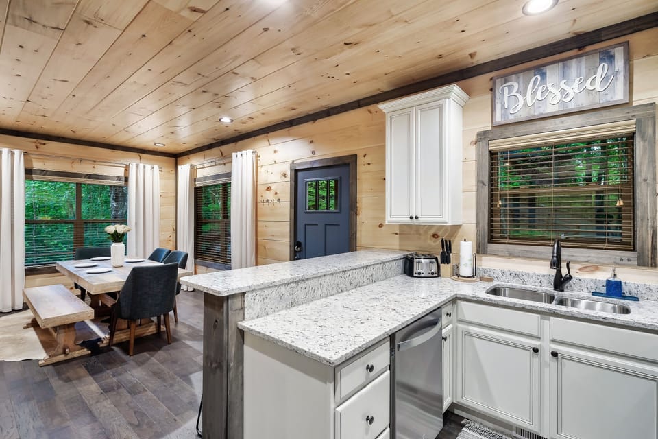 The laundry is downstairs near the kitchen.