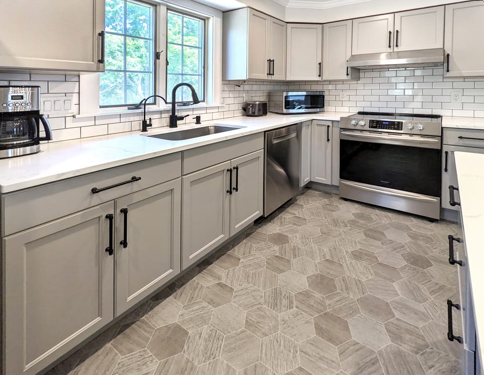 Well-appointed kitchen with island seating, open to living room 