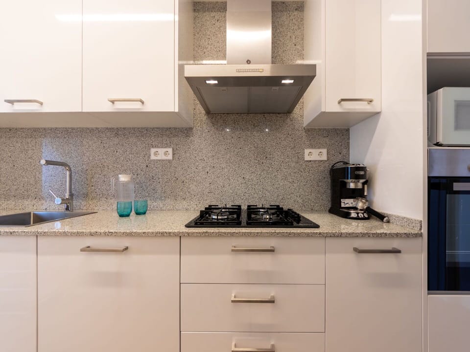 Cabinetry, Countertop, Building, Kitchen Stove, Kitchen Appliance, Kitchen Sink, Kitchen, Home Appliance, Drawer, Lighting