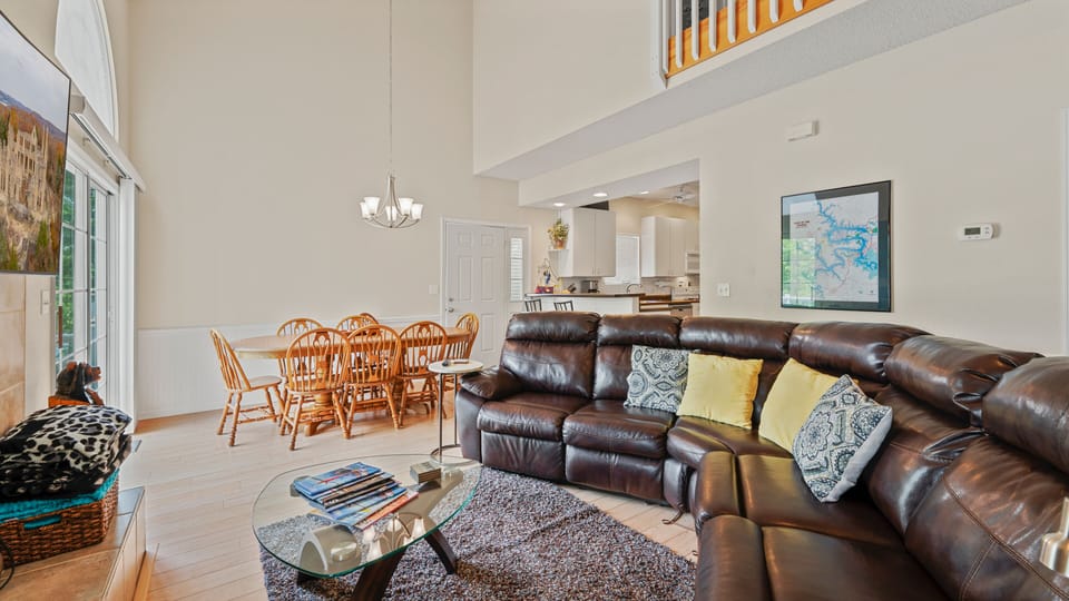 Comfortable living room with a large flat screen TV above the fireplace.