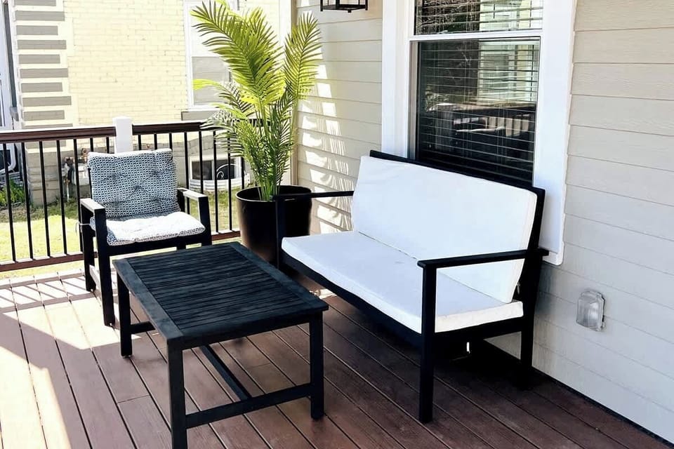 The front porch has this lovely seating area and beautiful lanterns for an authentic 1900's home feeling. 